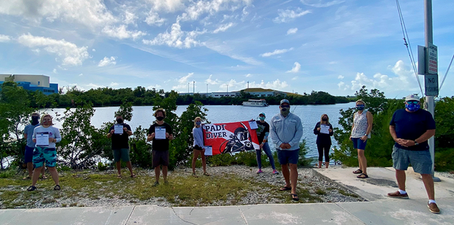 Back row L to R: course staff instructor Curtiss Carter, CFK marine science faculty Angelo “Jason” Spadaro, students Christy “Hannah” Fry, Skylar Saxon, and Madeline Ticer.   Front row L to R: Students Kim Platt, Daniel Metz, course director John Miller, course staff instructor and CFK dive faculty Lucja Rice, and PADI instructor examiner John Land. 